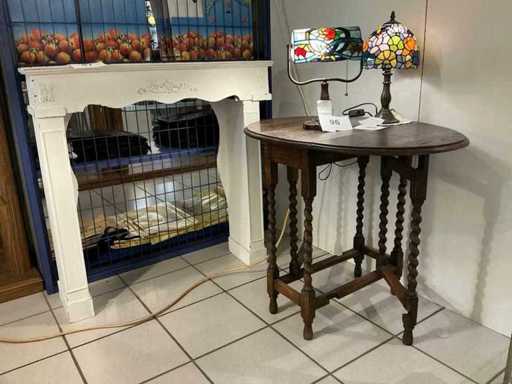 Antique oval folding table and decorative fireplace