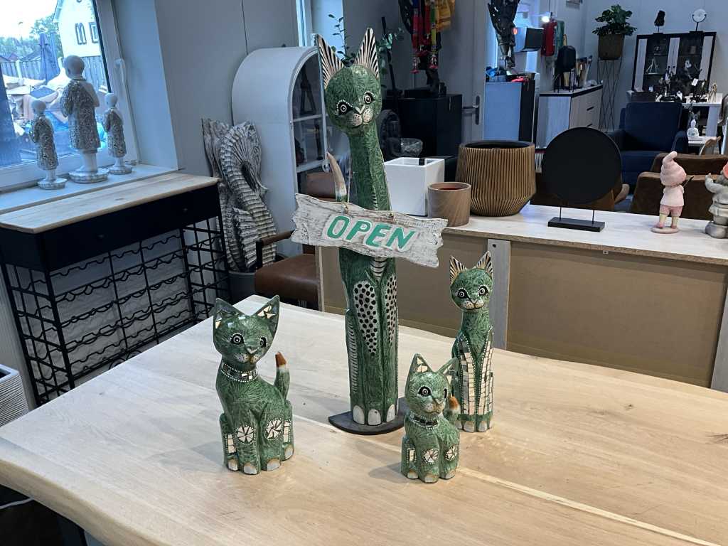 4 different wooden cats