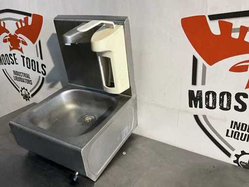 Knee-operated hand wash basin
