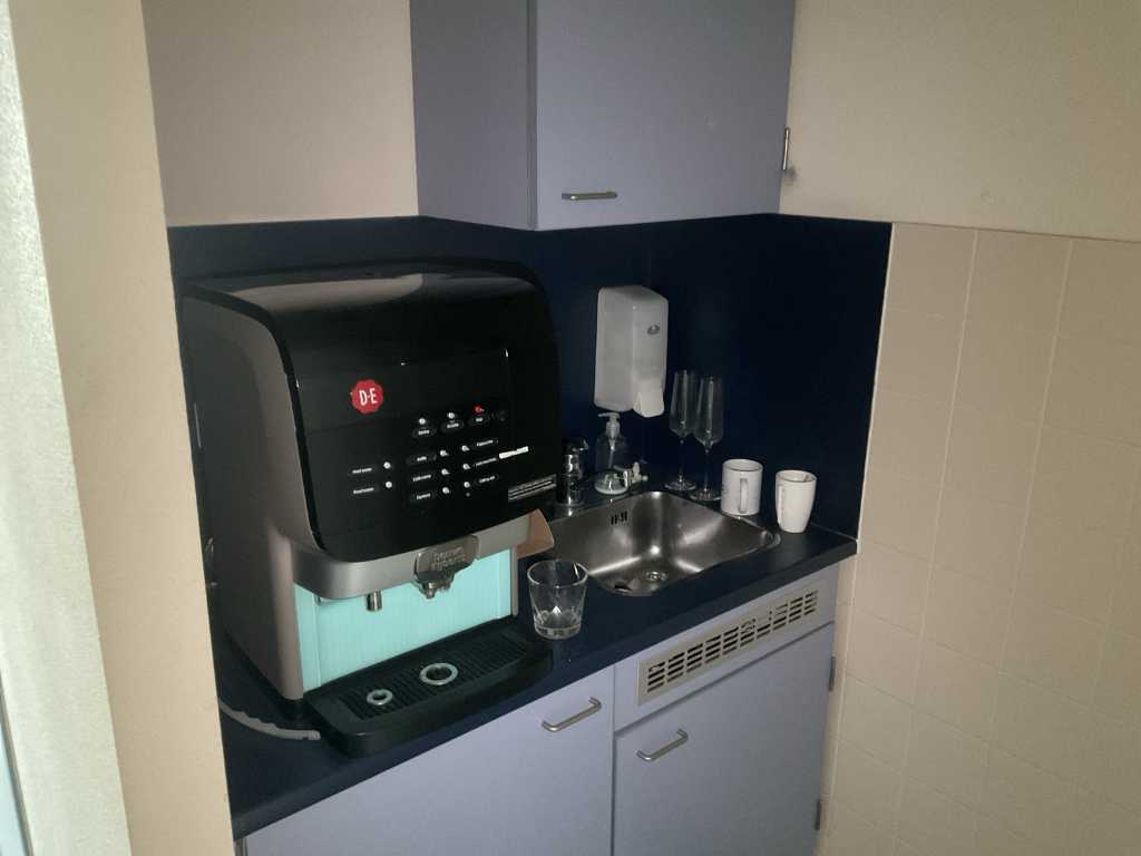 Douwe Egberts Coffee machine with coffee supplies  