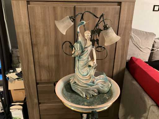 Elegant porcelain figure with integrated lighting with fountain