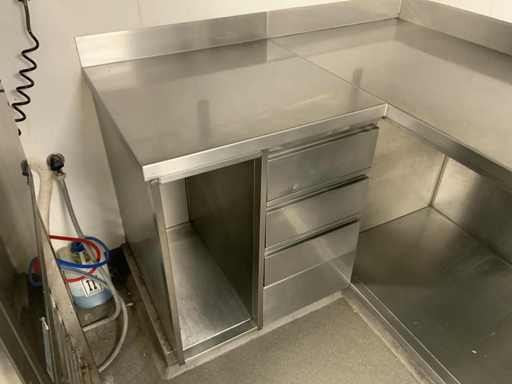 Tavolo da lavoro in acciaio inox con cassetti