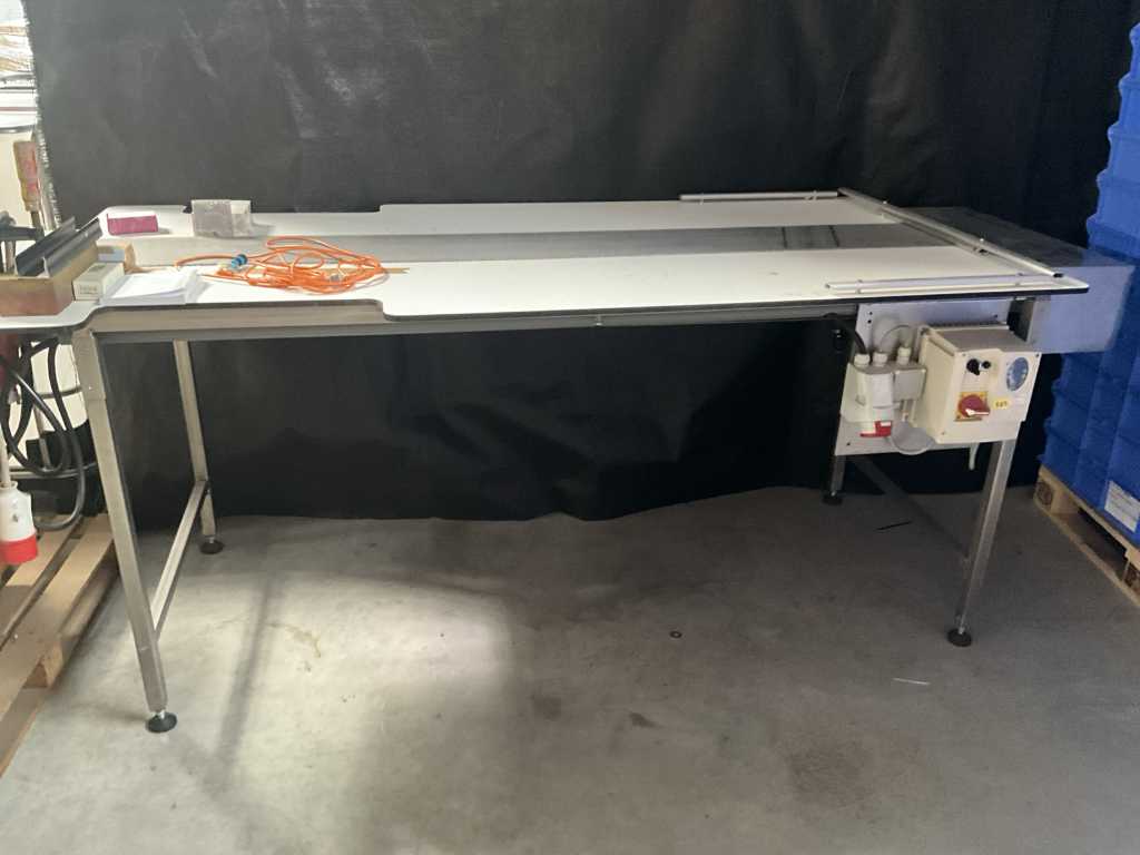 Work table with conveyor belt in the middle