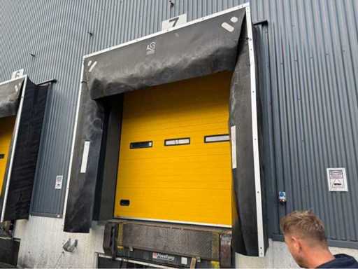 Dock leveler with door and flaps
