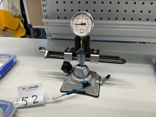 Werkstukhouder met gevulde drukmeter