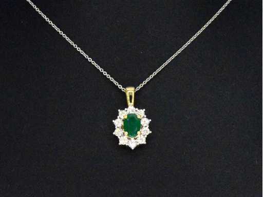Goldener Anhänger mit ovalem Smaragd und Diamanten