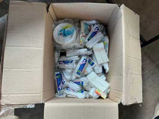Box of plastic plates and cutlery