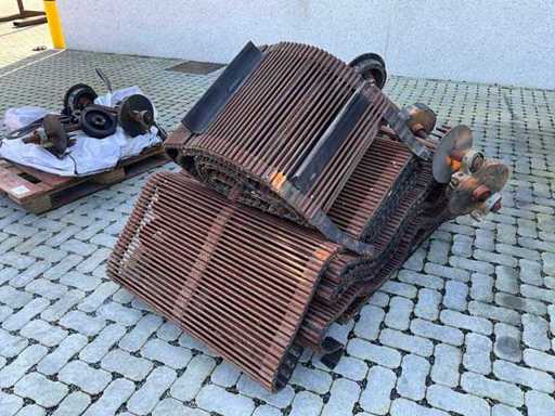 Tapis de chaîne avec roues de roulement