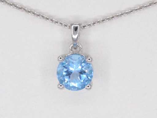 Pendentif en or blanc avec topaze