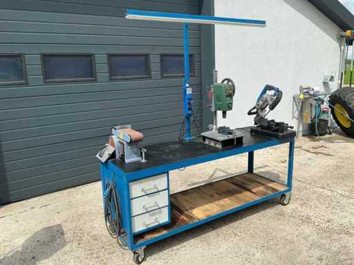 Column drill, band saw and sander on work table