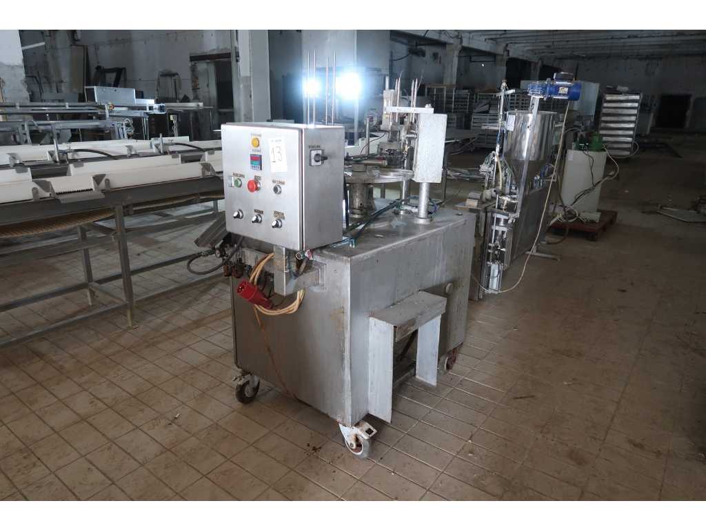 machine for filling and sealing boxes