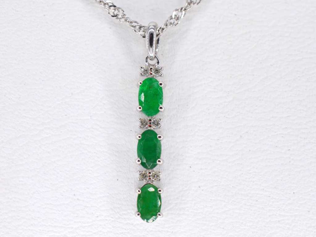 White gold pendant with diamonds and emerald