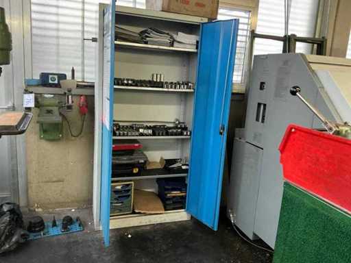 Hinged door cabinet including assortment of clamping jaws