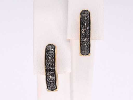 Goldene Ohrringe mit schwarzem Diamant