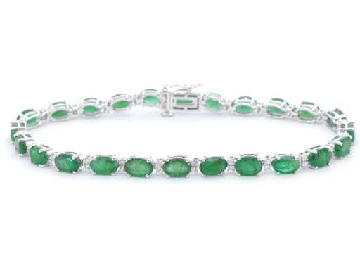 Bracelet de tennis en or blanc avec diamants et émeraude